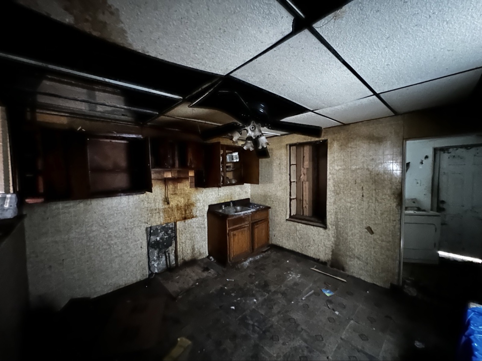 A gutted, water-damaged kitchen the day we bought the house